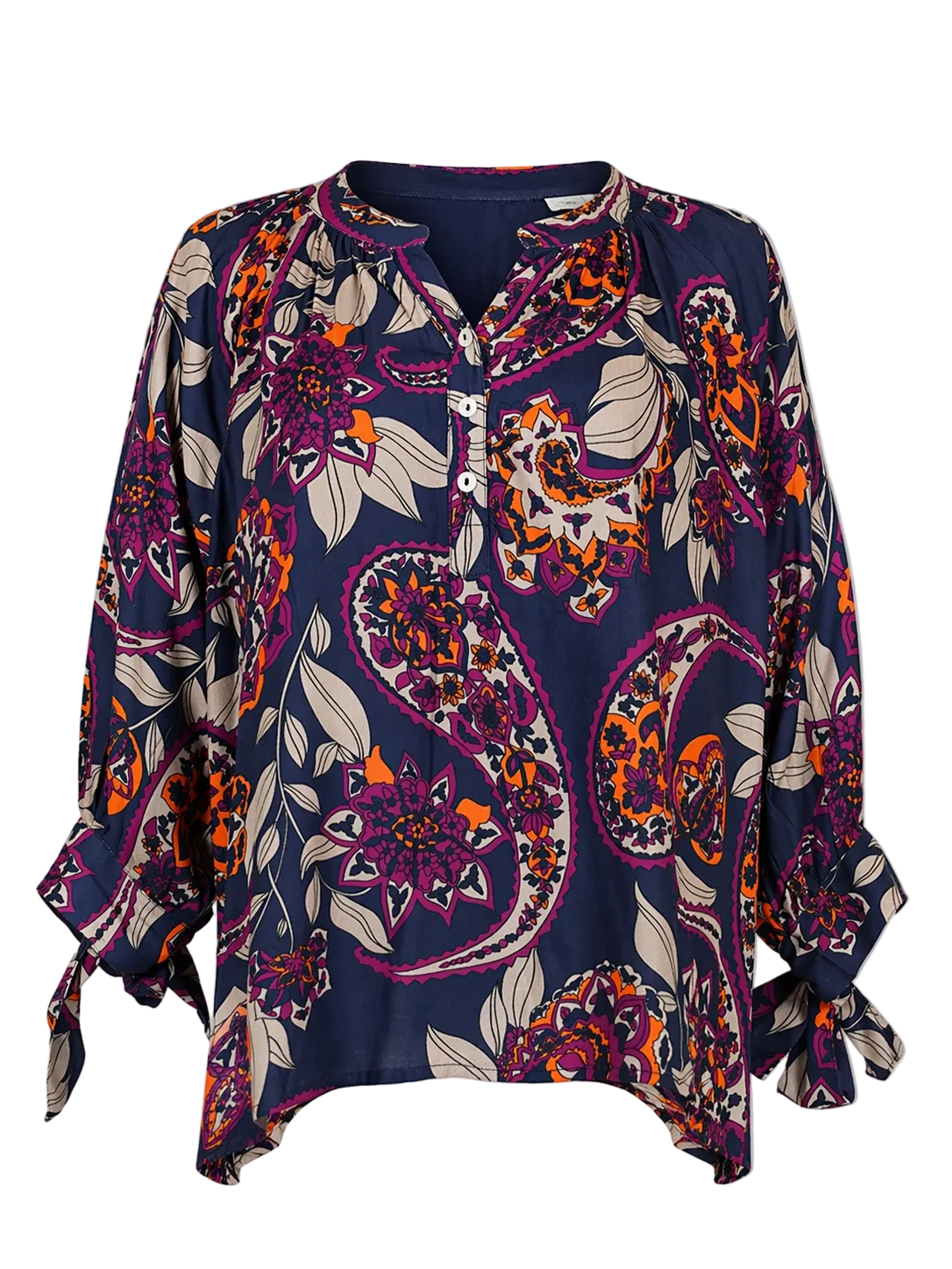 Colorful patterned blouse on a gray background